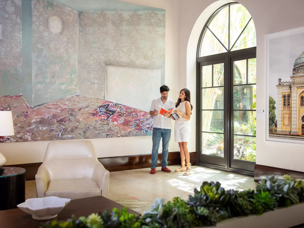 Guests viewing contemporary art at The Alfond Inn in Winter Park