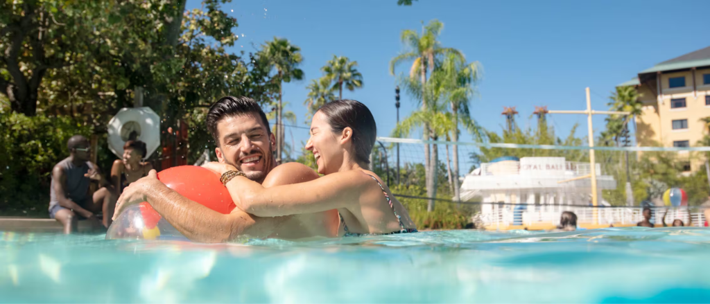 Guests relaxing in the pool at Loews Royal Pacific Resort