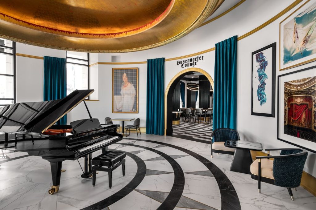 Art-filled lobby with piano at Grand Bohemian Hotel Orlando