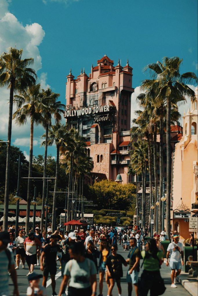 Crowds walking past the Hollywood Tower Hotel in Orlando