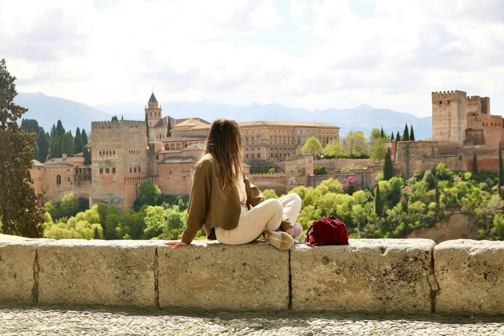 Enjoying panoramic view of Granada and historic buildings