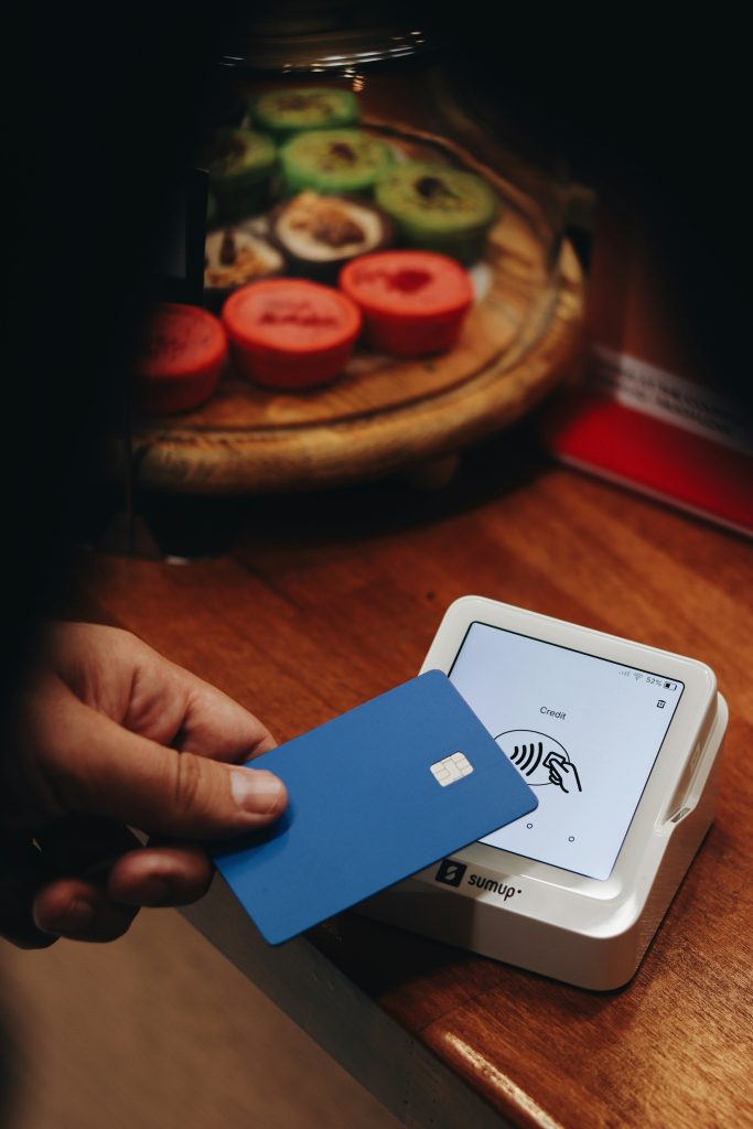 Customer paying by card on contactless terminal