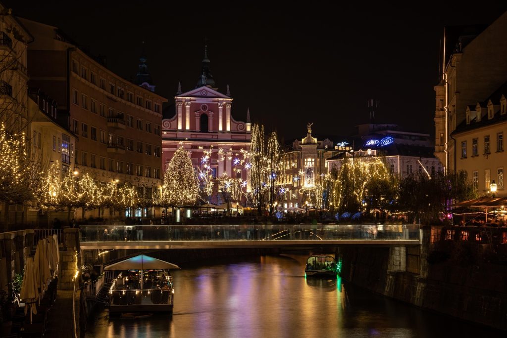 Ljubljana river at night with festive holiday lights