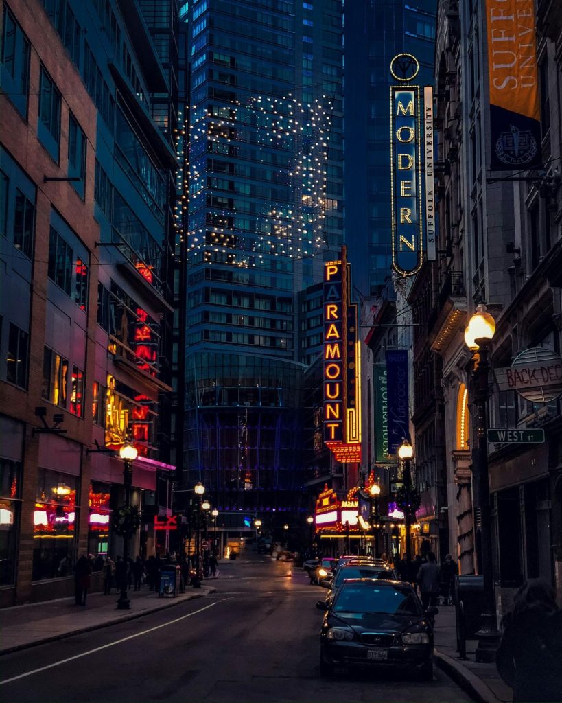 Boston Theatre District street with Paramount sign at night