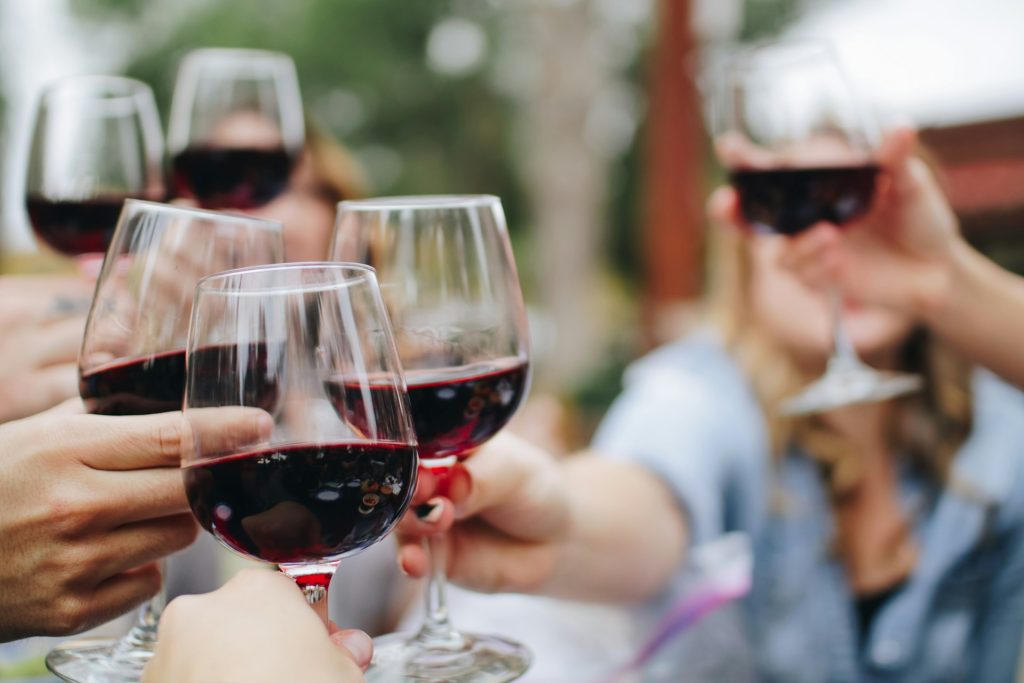 People enjoying Madeira wine, one of the island’s most traditional and popular souvenirs