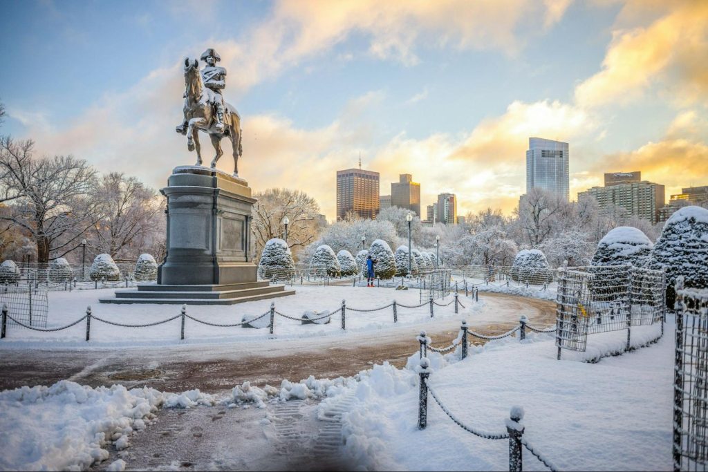 Snow-covered Boston Public Garden with Washington statue