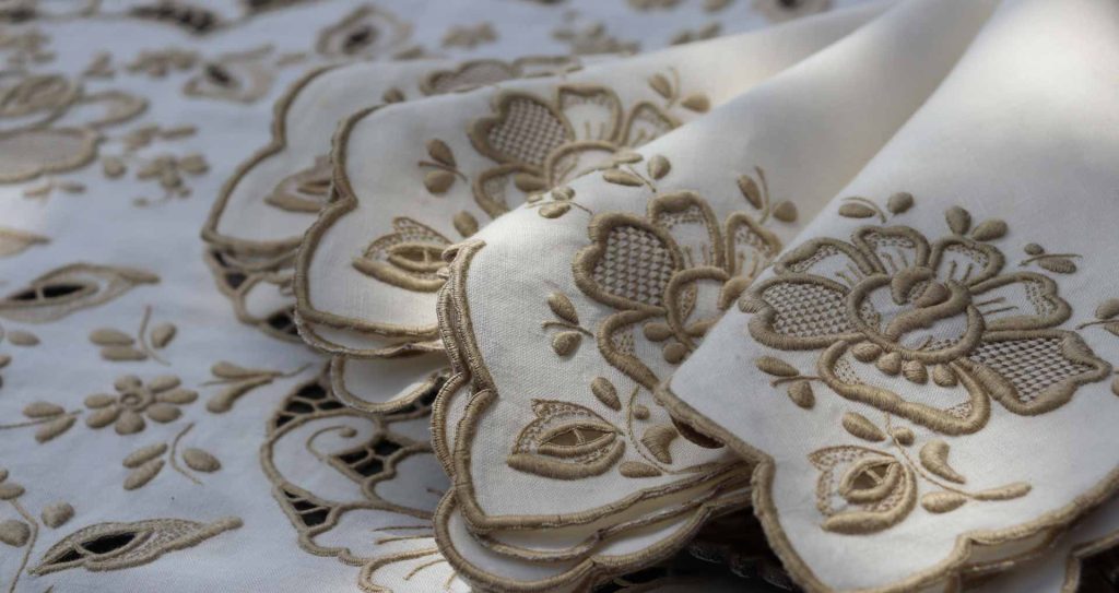Traditional Madeira embroidery with delicate floral patterns, a classic island souvenir.