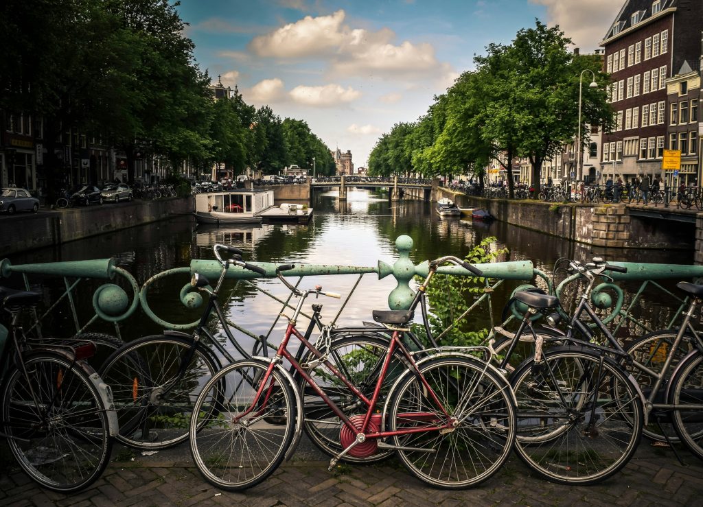 Bicycles by a canal bridge in Amsterdam