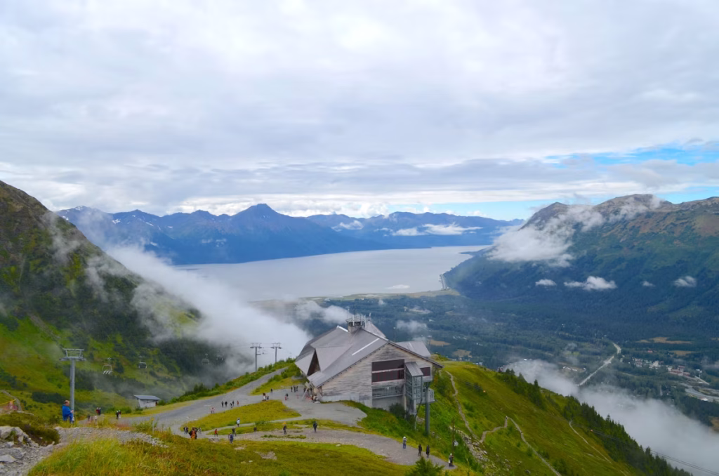 Mountain tram station overlooking valley and coastal inlet in Alaska